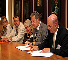 From the right, Associate Vice Chancellor Ambassador Robert R. Gosende and Rector Dr. Adam Koseski are signing Memoranda of Understanding between SUNY and the Pultusk Higher School of Humanities.