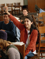 Female student in classroom with a question