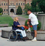 Female student in wheelchair in conversation