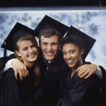 Three happy graduates in robes