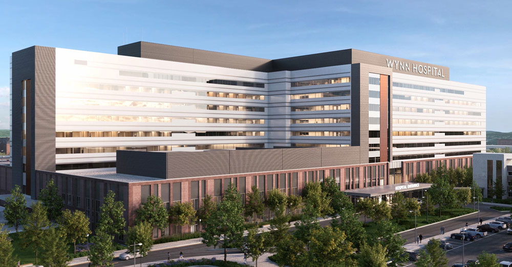 Student apprentices work in a classroom with machine tools.