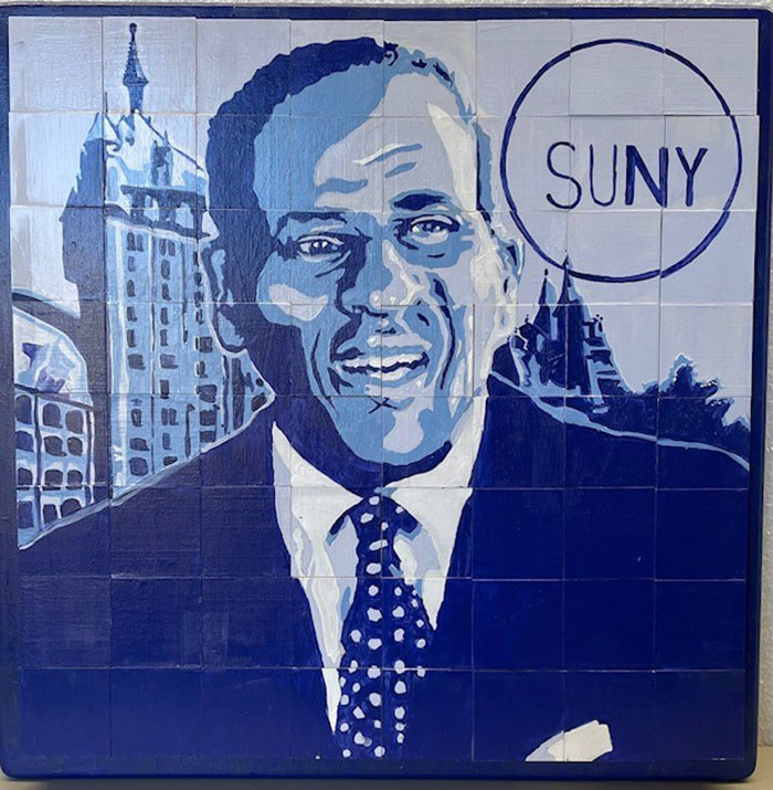 Mosaic art of H Carl McCall by students of the Art Force 5.