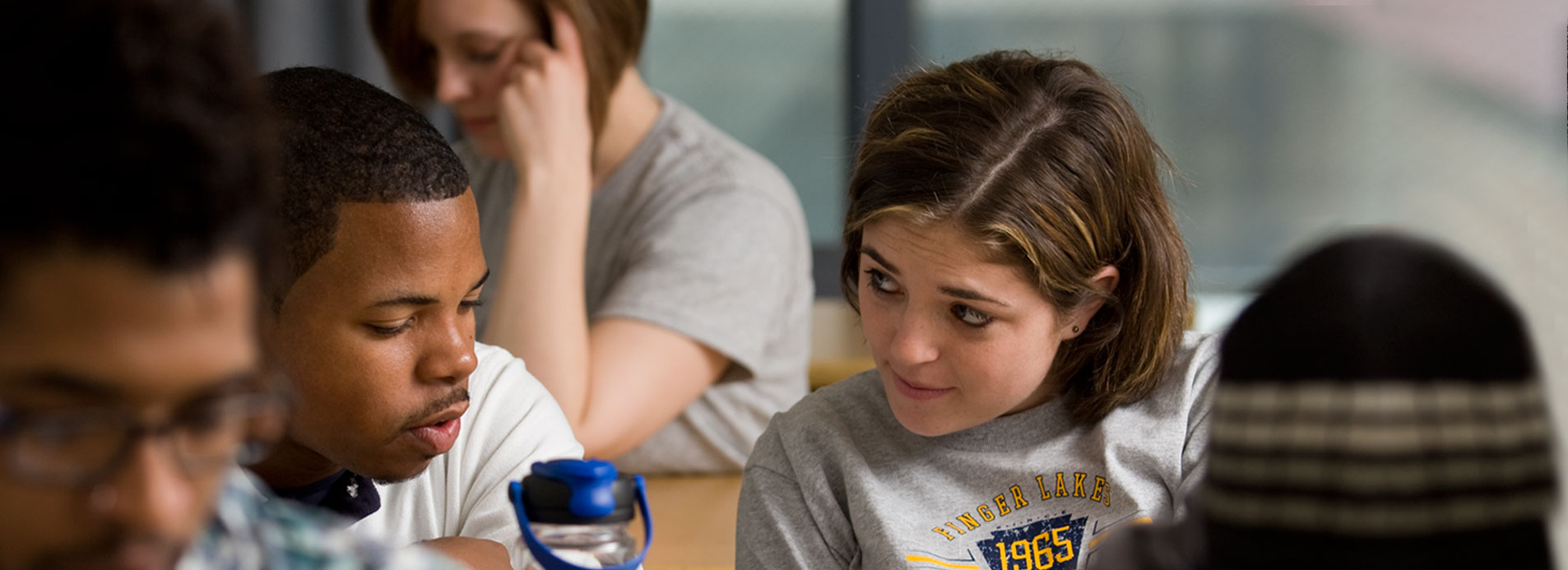 Finger Lakes Community College students at desks in the classroom. 