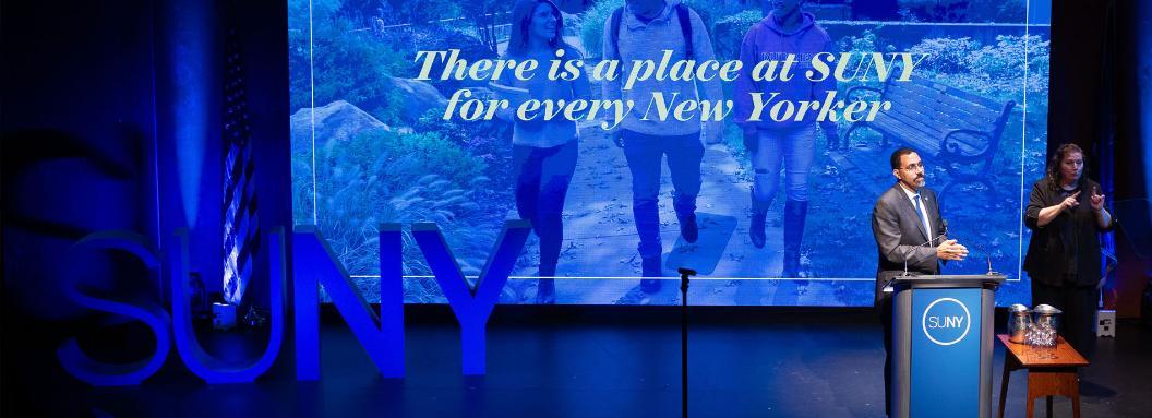 Chancellor JohnB King Jr delivers the 2024 SUNY State of the University Address on stage.