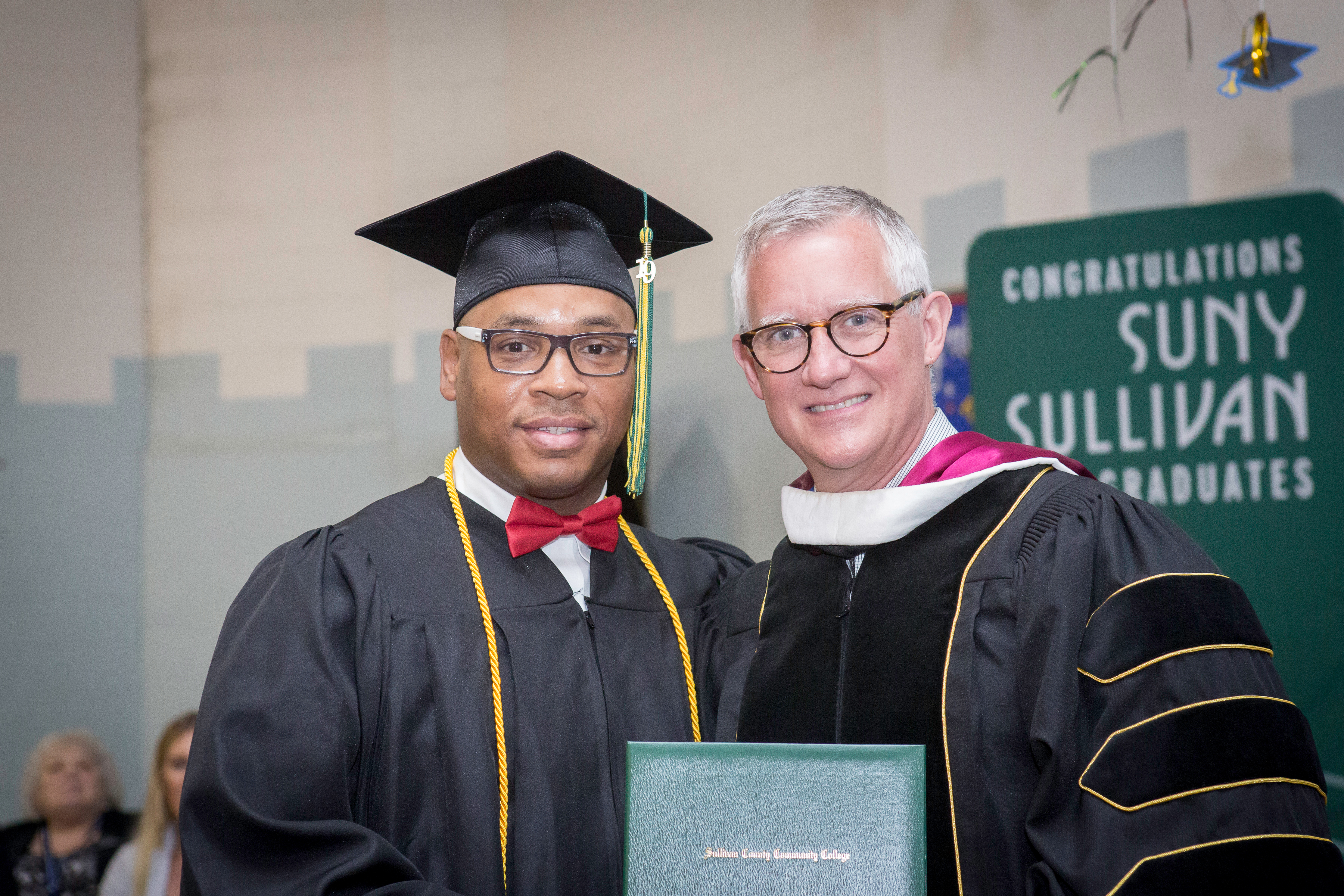 Presient Quaintance of SUNY Sullivan with Graduate, Shawangunk 2019; Photography by Babita Patel/Hudson Link for Higher Education in Prison