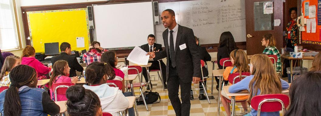 African-American teacher in elementary school classroom. 