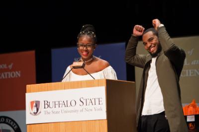 A female and male student at Buffalo State celebrate being recognized at the EOP Honors ceremony.