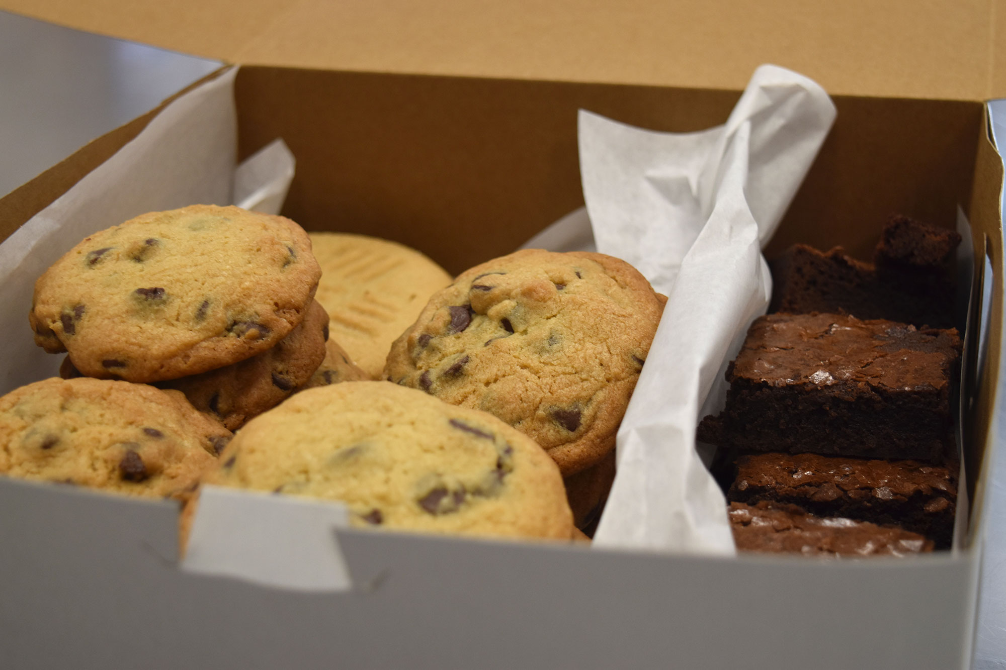 Box full of chocolate chip cookies and brownies. 