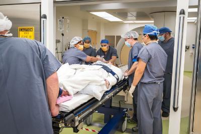 Doctors treat a patient in the multi-disciplinary OR suite at the Upstate Cancer Center.