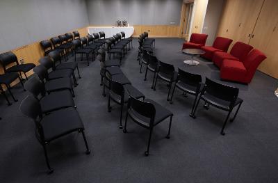  A multi-purpse room at the SUNY Global Center with chairs set up theater style. 