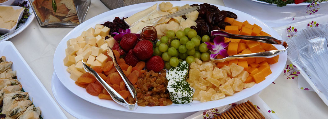 Fruit and cheese plate on a buffet table. 