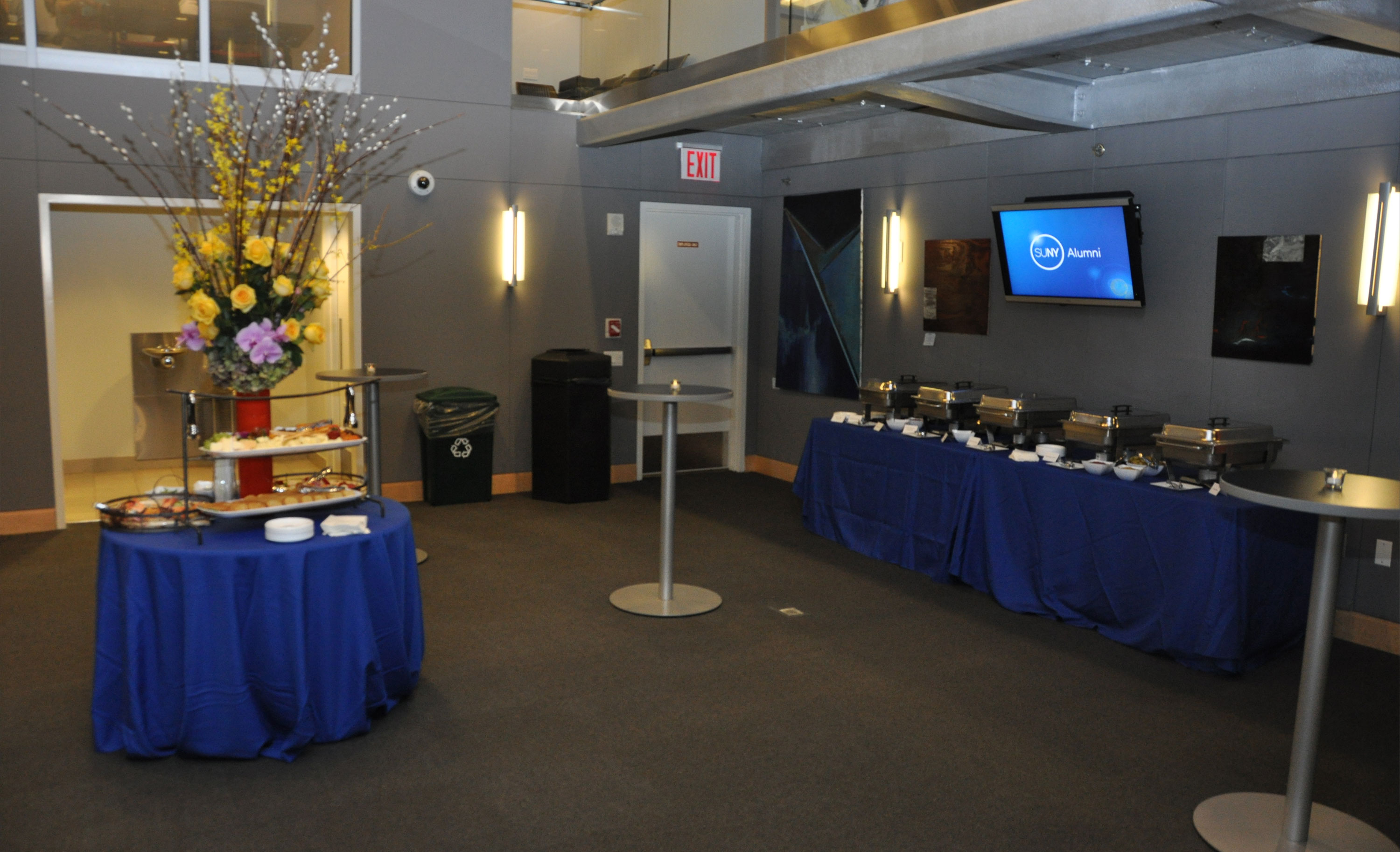 Reception area outside the SUNY Global Center global classroom set up with food and drink stations.