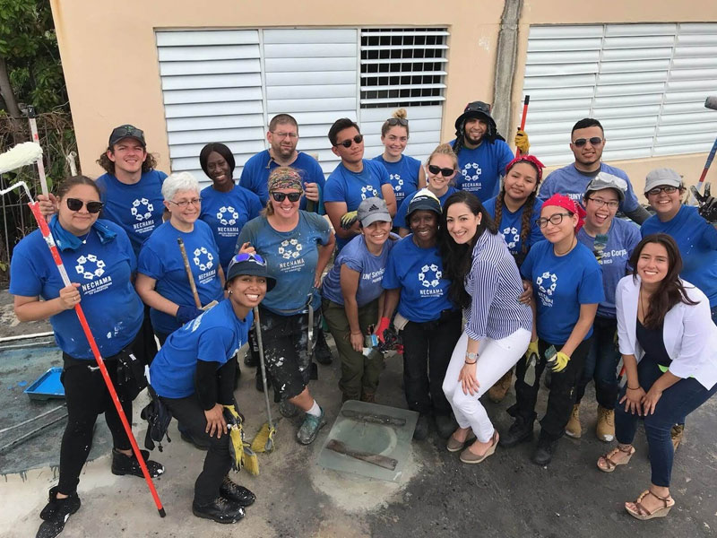 Student volunteers pose for a picture after repair work in Puerto Rico.