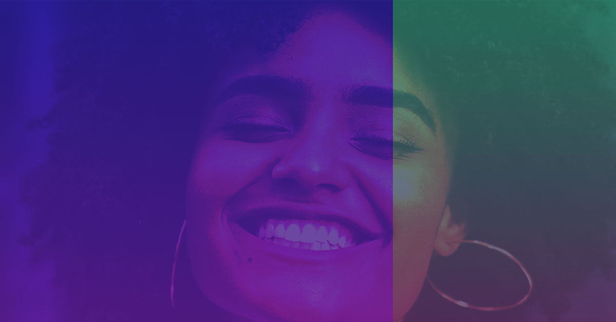 African American girls smiles wide with blue and green gradient over image.