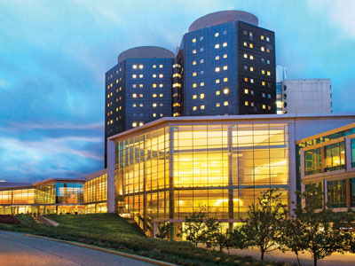 Stony Brook University hospital building at dusk.