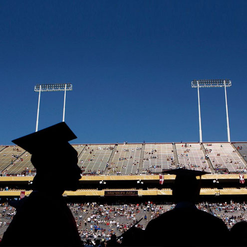 A commencement taking place in a football stadium.