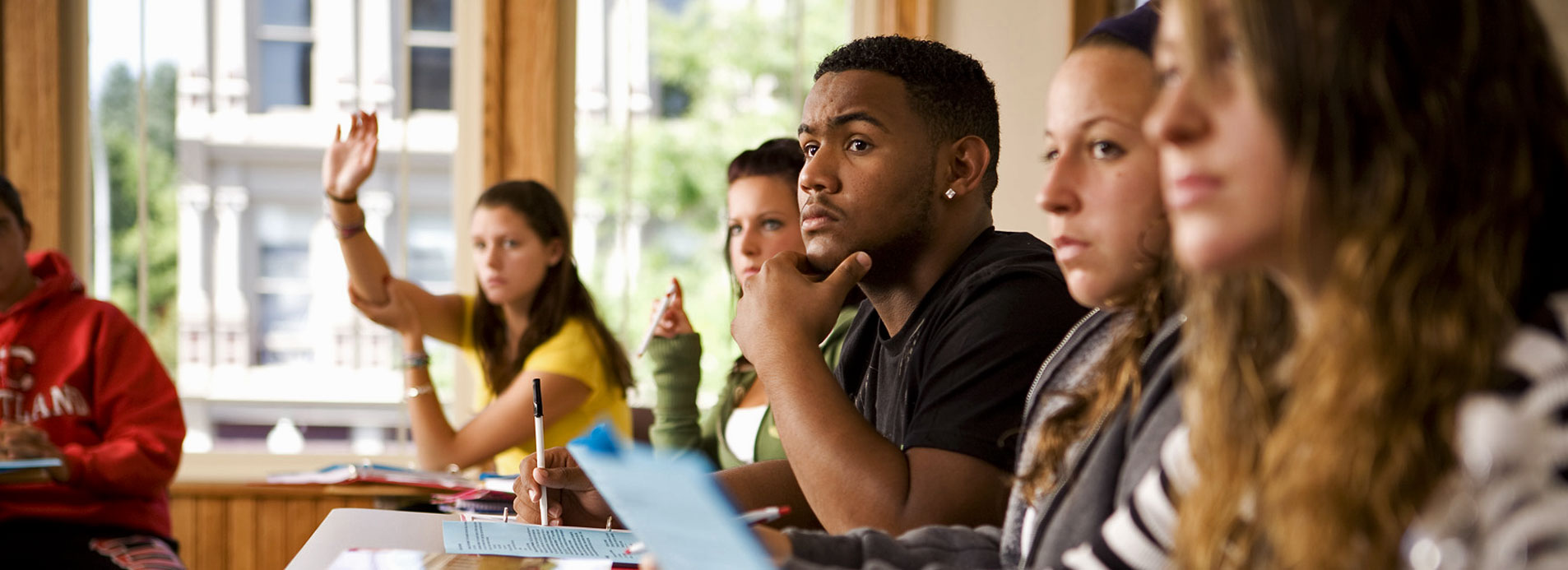 SUNY Cortland students in classroom look toward teacher.