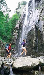 Hiking by waterfall