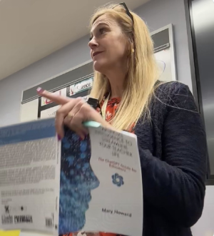 mary howard holding her book