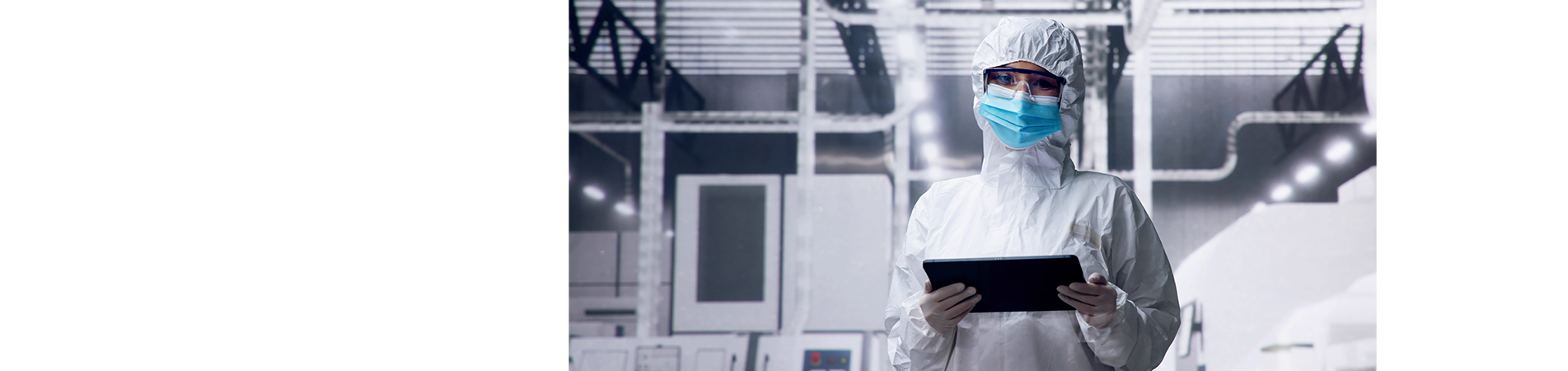 female in white overalls in clean room