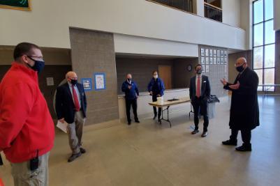 Chancellor Malatras tours the inside of a Clinton Community College building as to review COVID reopening protocols.