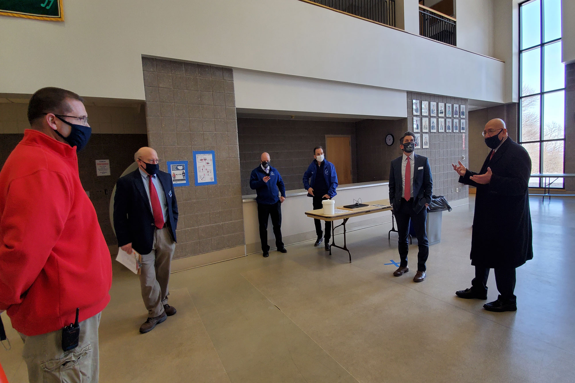 Chancellor Malatras tours the inside of a Clinton Community College building as to review COVID reopening protocols.