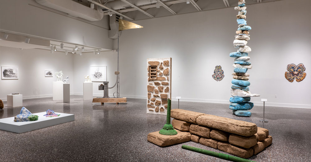 Interior exhibit space showing art pieces of natural rock inside the Dorsky Museum at SUNY New Paltz.