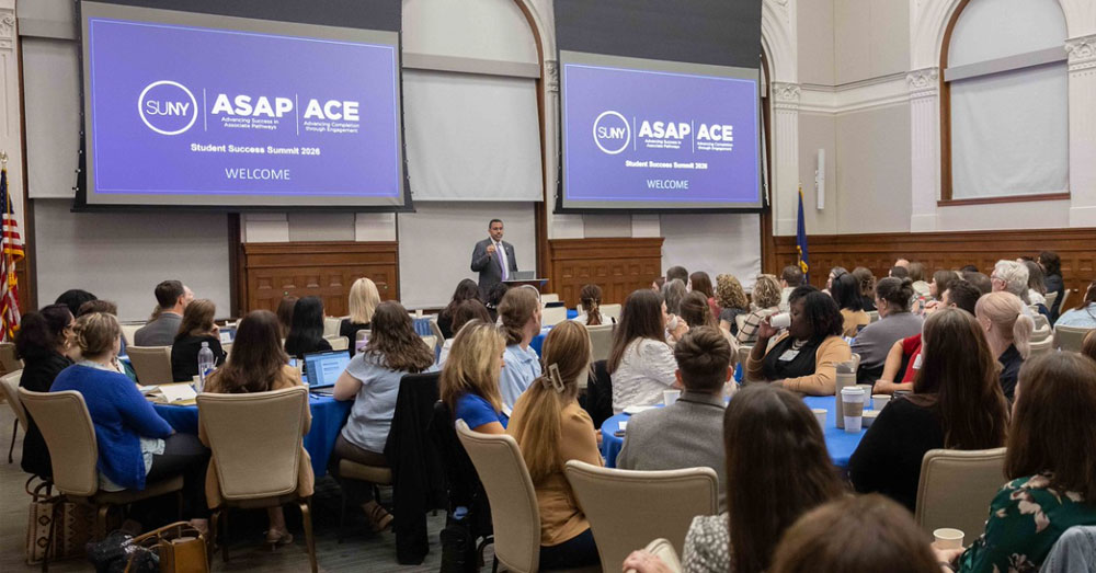 Tables filled with students and educators in the Nancy Zimpher Boardroom at SUNY System Administration during the 2026 ASAP ACE Student Success Summit.