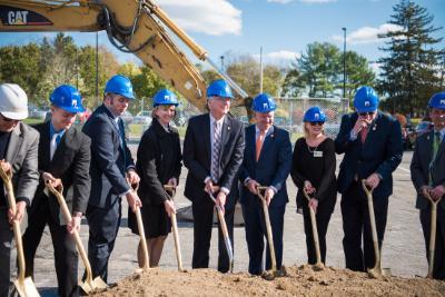 Leaders stand with shovels in ground at the New Paltz Engineering Hub groundbreaking