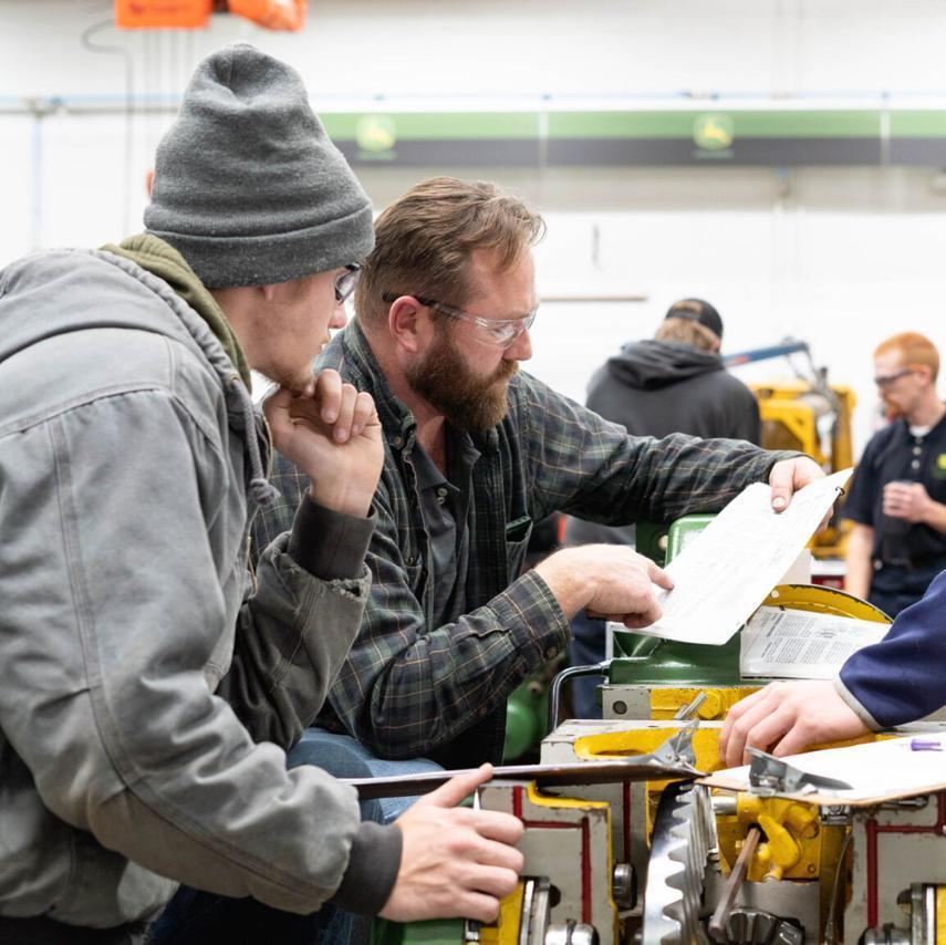 The power trains class goes over drive ratios on a transmission trainer.