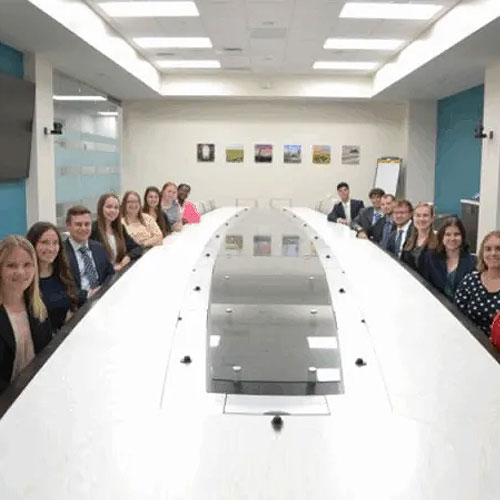 Interns at Farm Credit East in Connecticut sit around a large conference table. Photo courtesy Morning Ag Clips.