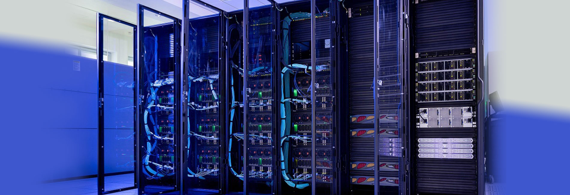 A wall of computer servers in a room.