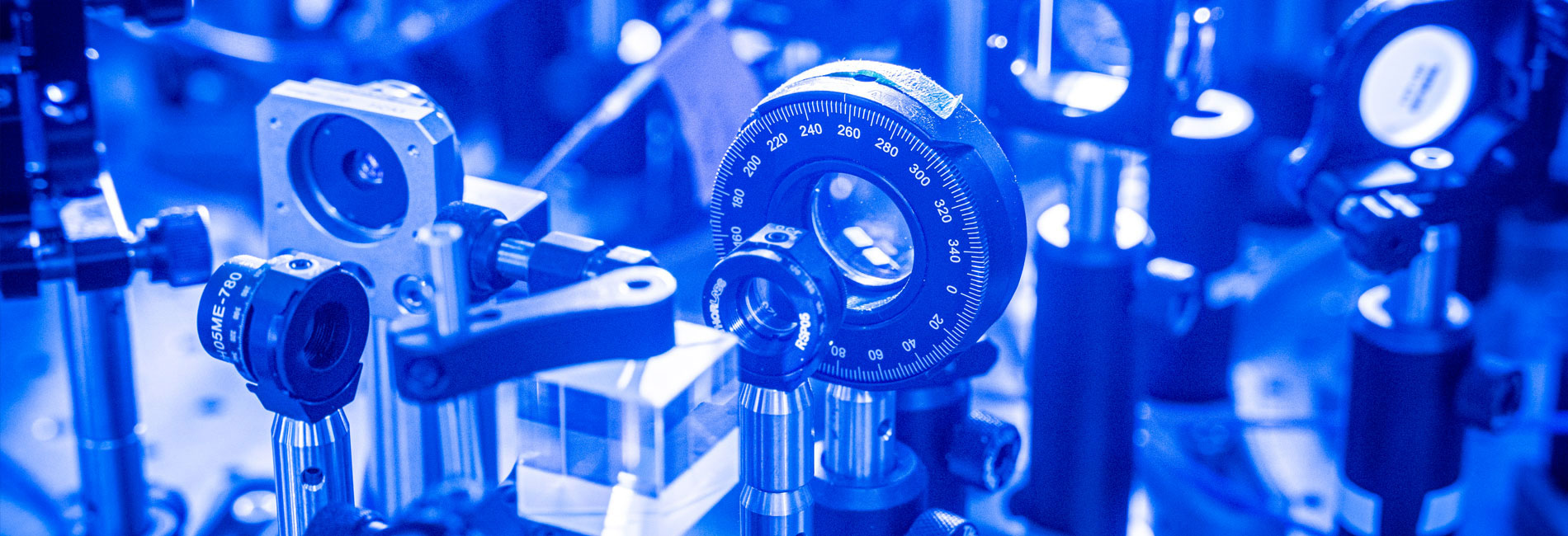 Quantum mechanical components up close under blue light.