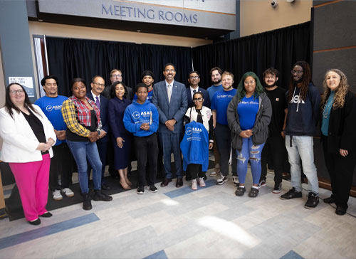 SUNY Chancellor John B. King Jr. stands with students and staff at Hudson Valley Community College during an event celebrating ASAP ACE expansion at SUNY.