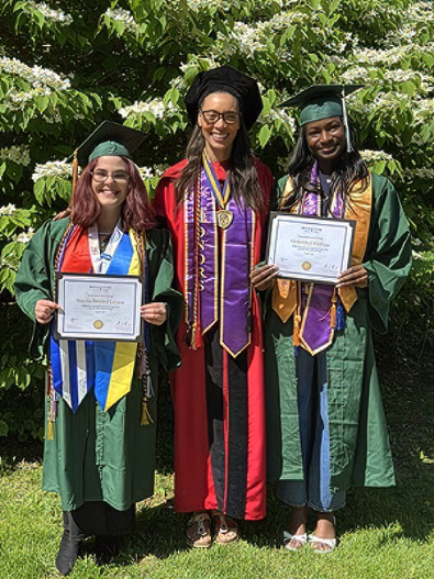 Benitez group photo holding up diplomas