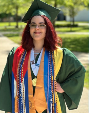 Natalia Benitez dressed in graduation cap and gown